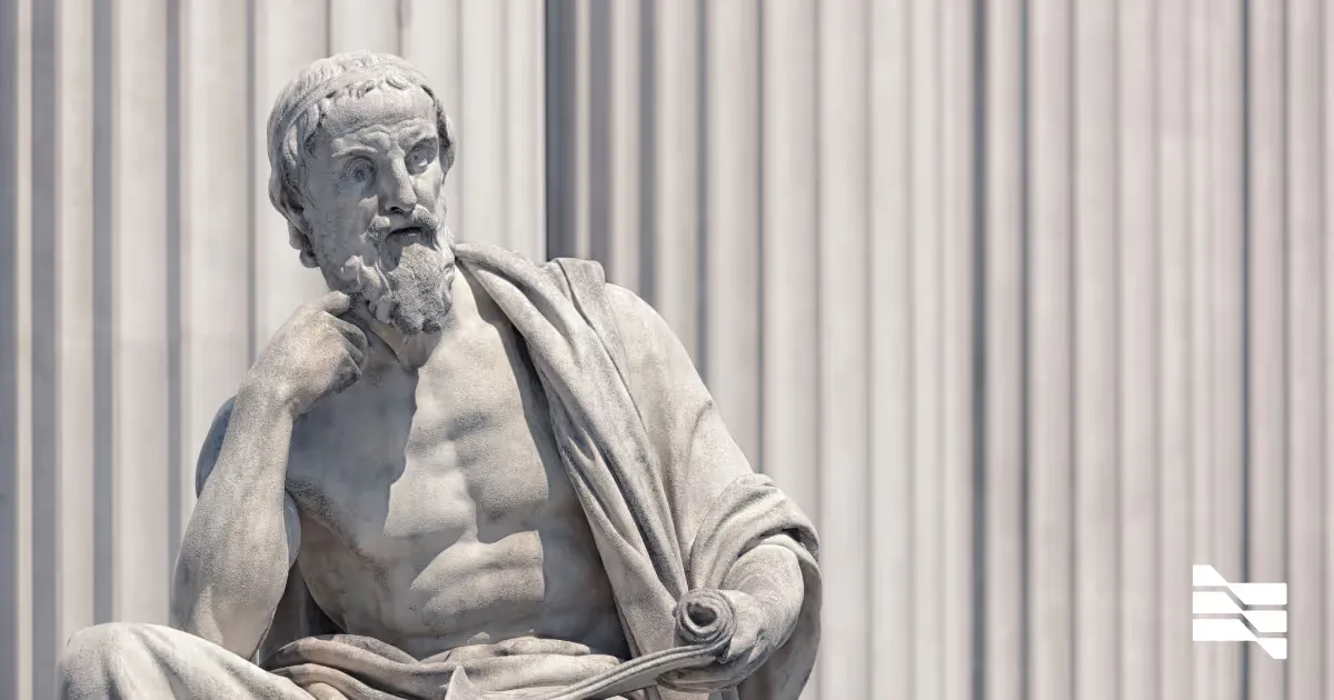 A marble statue of a seated classical philosopher